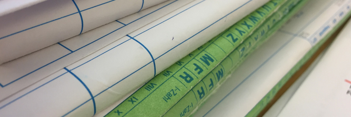 Close up of stack of medical files